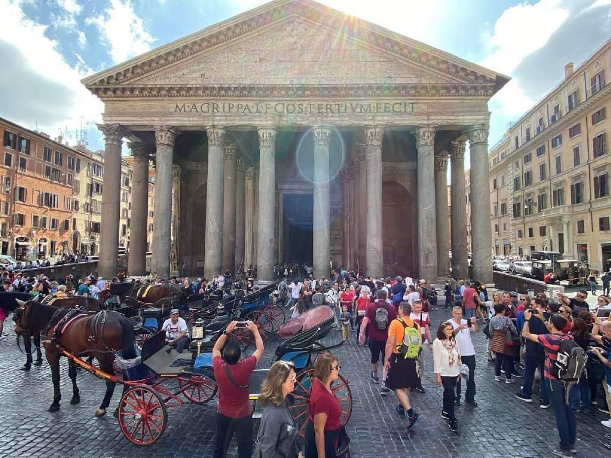 a group of people walking in front of a crowd